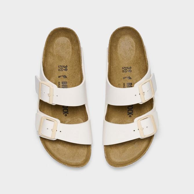 Back view of Women's Birkenstock Arizona Birkibuc Sandals (Big Kids Sizes Available) in Eggshell Click to zoom