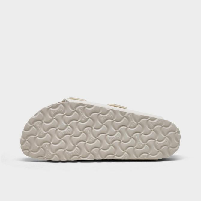 Bottom view of Women's Birkenstock Arizona Birkibuc Sandals (Big Kids Sizes Available) in Eggshell Click to zoom