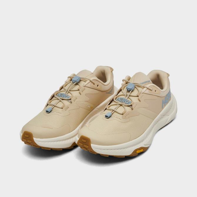 Three Quarter view of Women's HOKA Transport Athletic Lifestyle Shoes in Oak/Alabaster Click to zoom