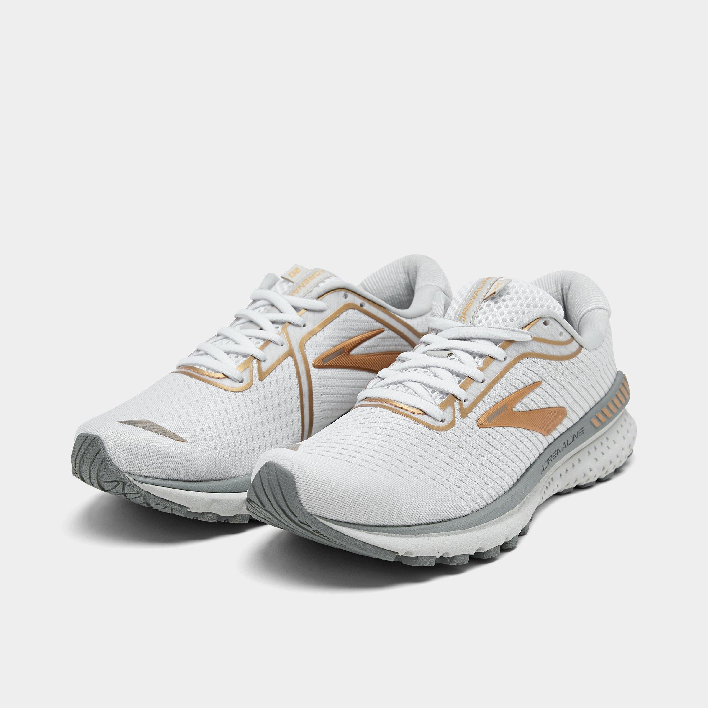 white and gold brooks shoes