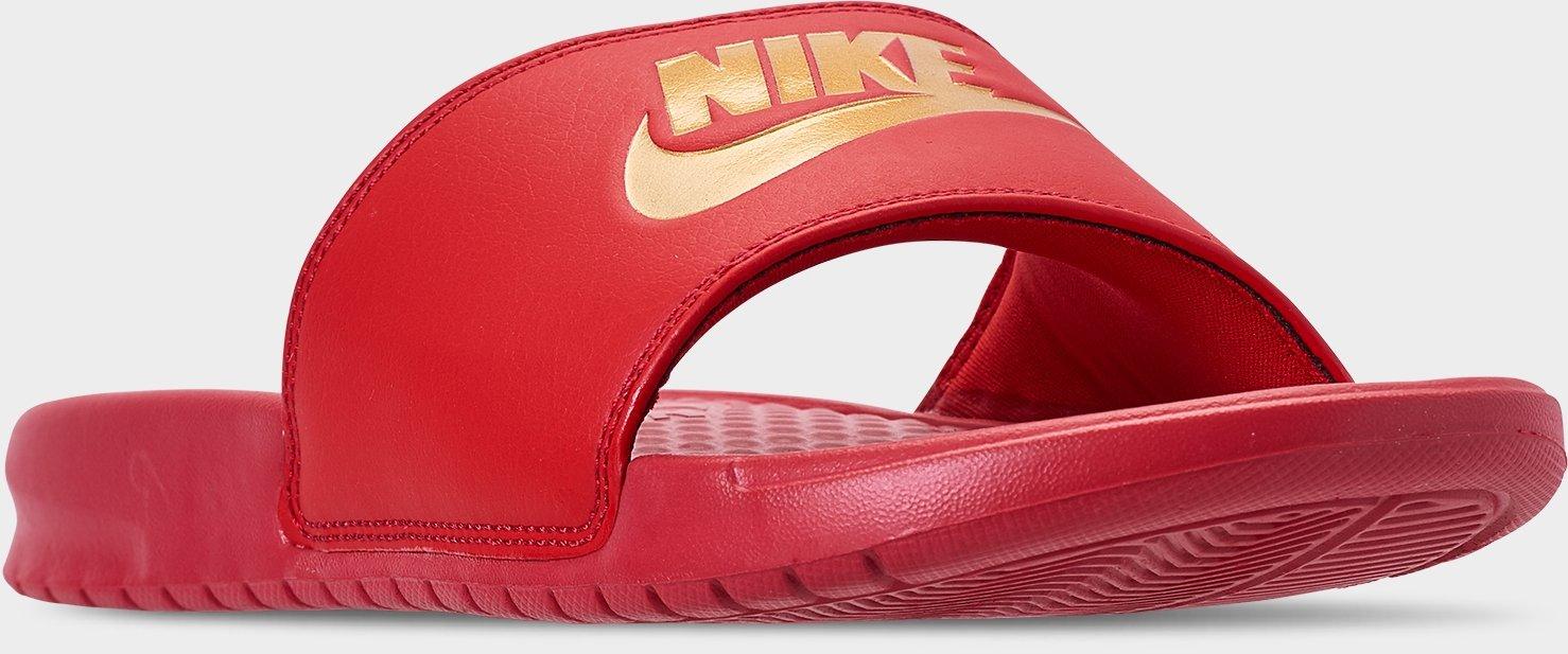 red and gold nike flip flops