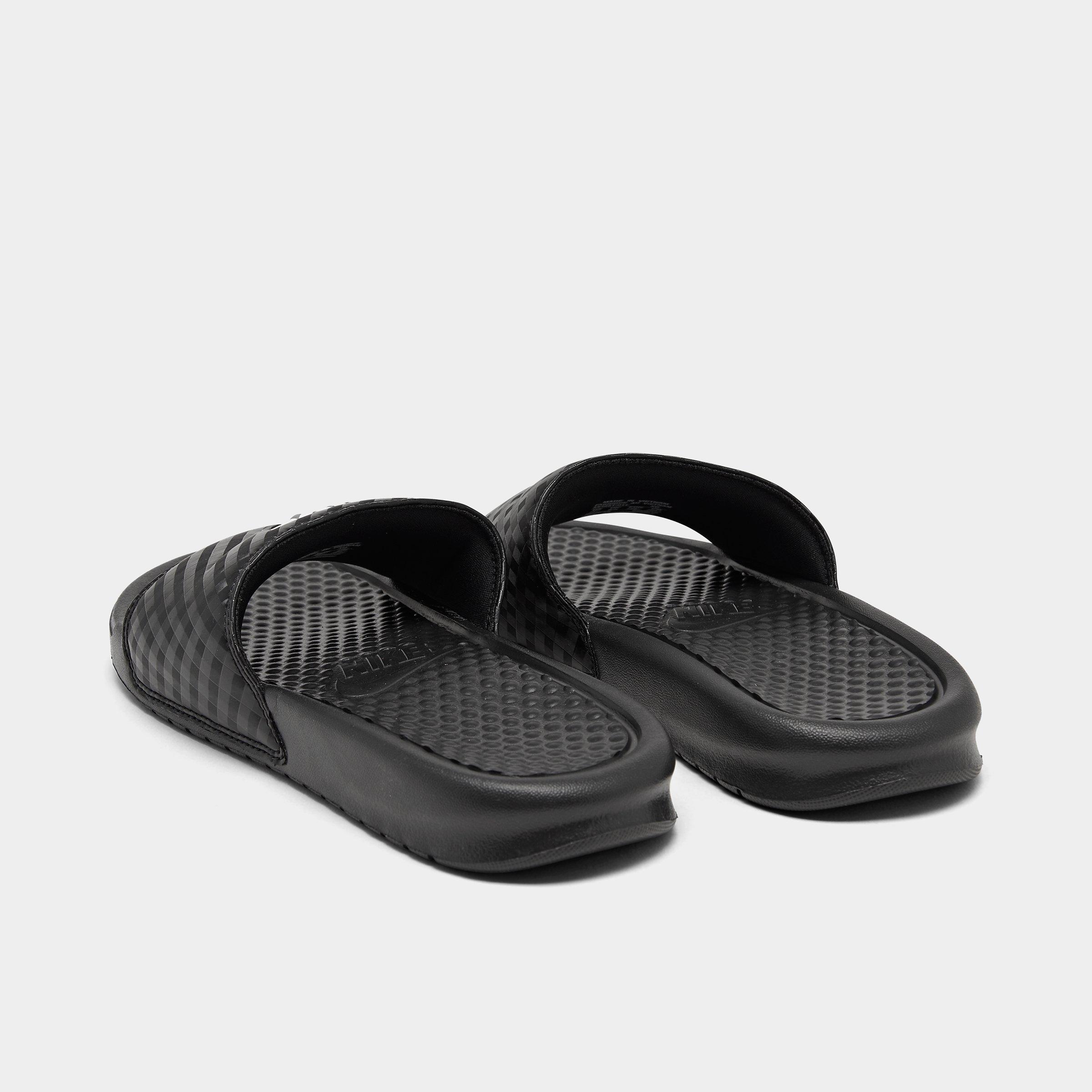 black nike slides with gold swoosh