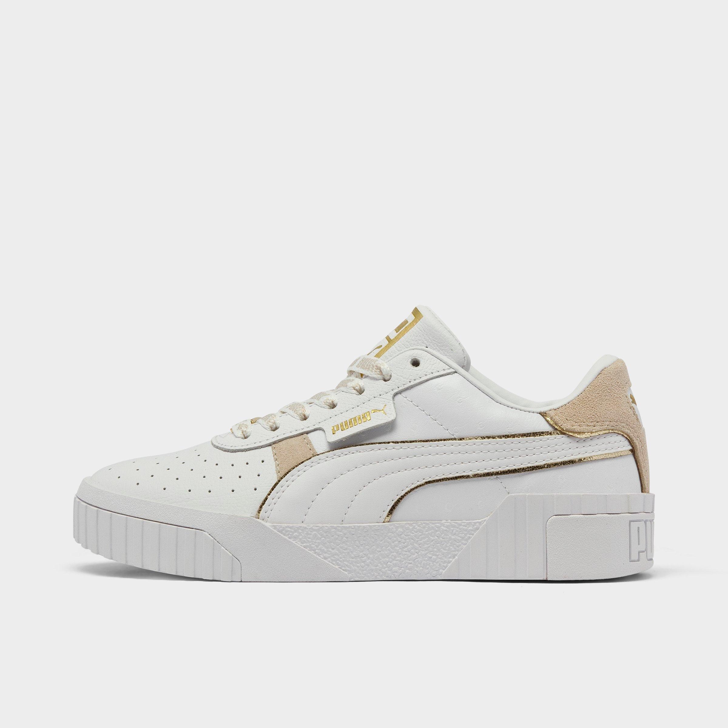 white pumas with gold