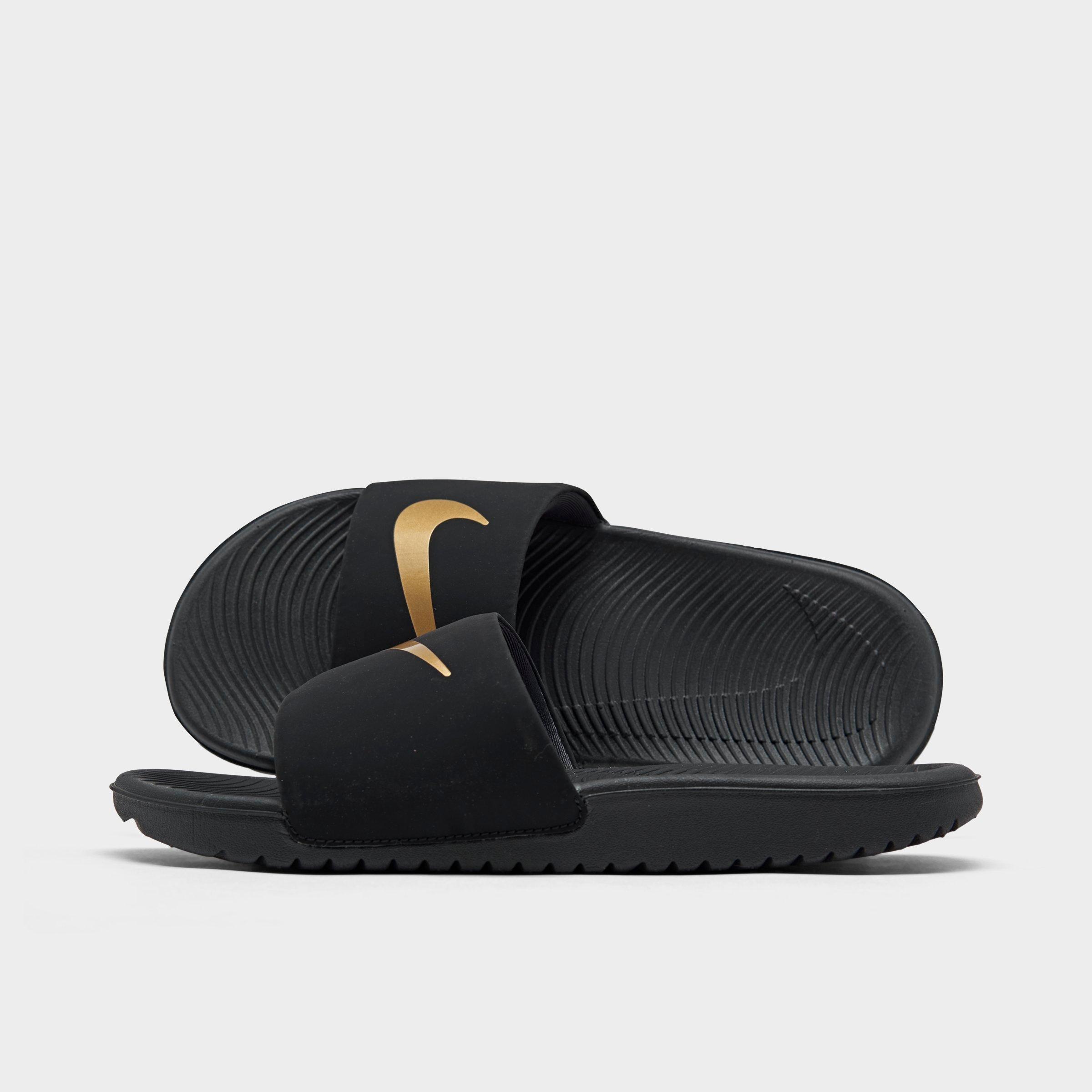 nike kawa slides black and gold