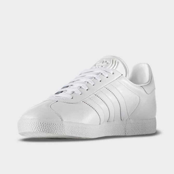 White and 2024 gold adidas trainers