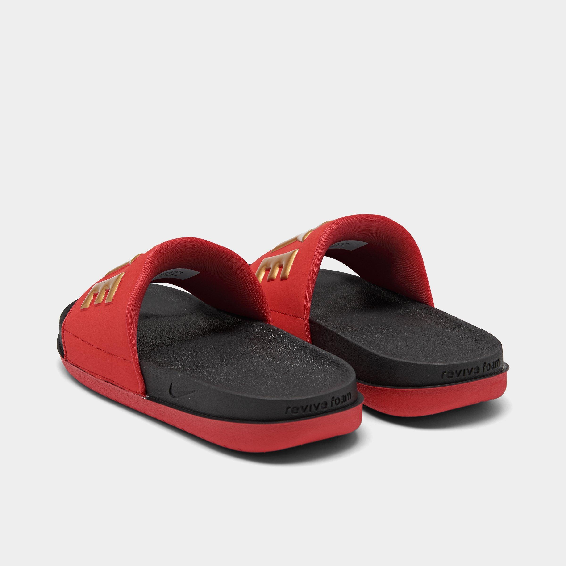 red black and gold nike slides