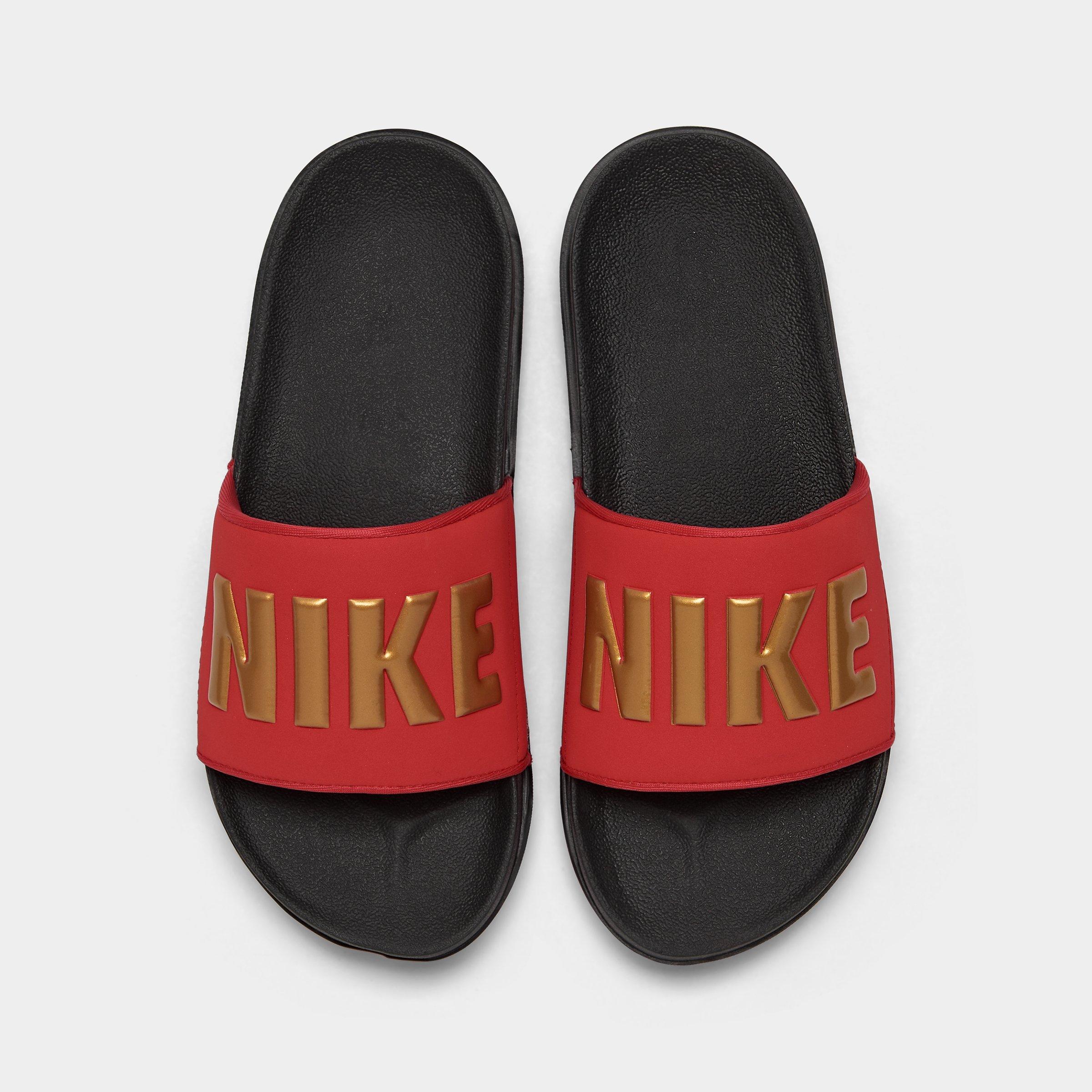 red black and gold nike slides