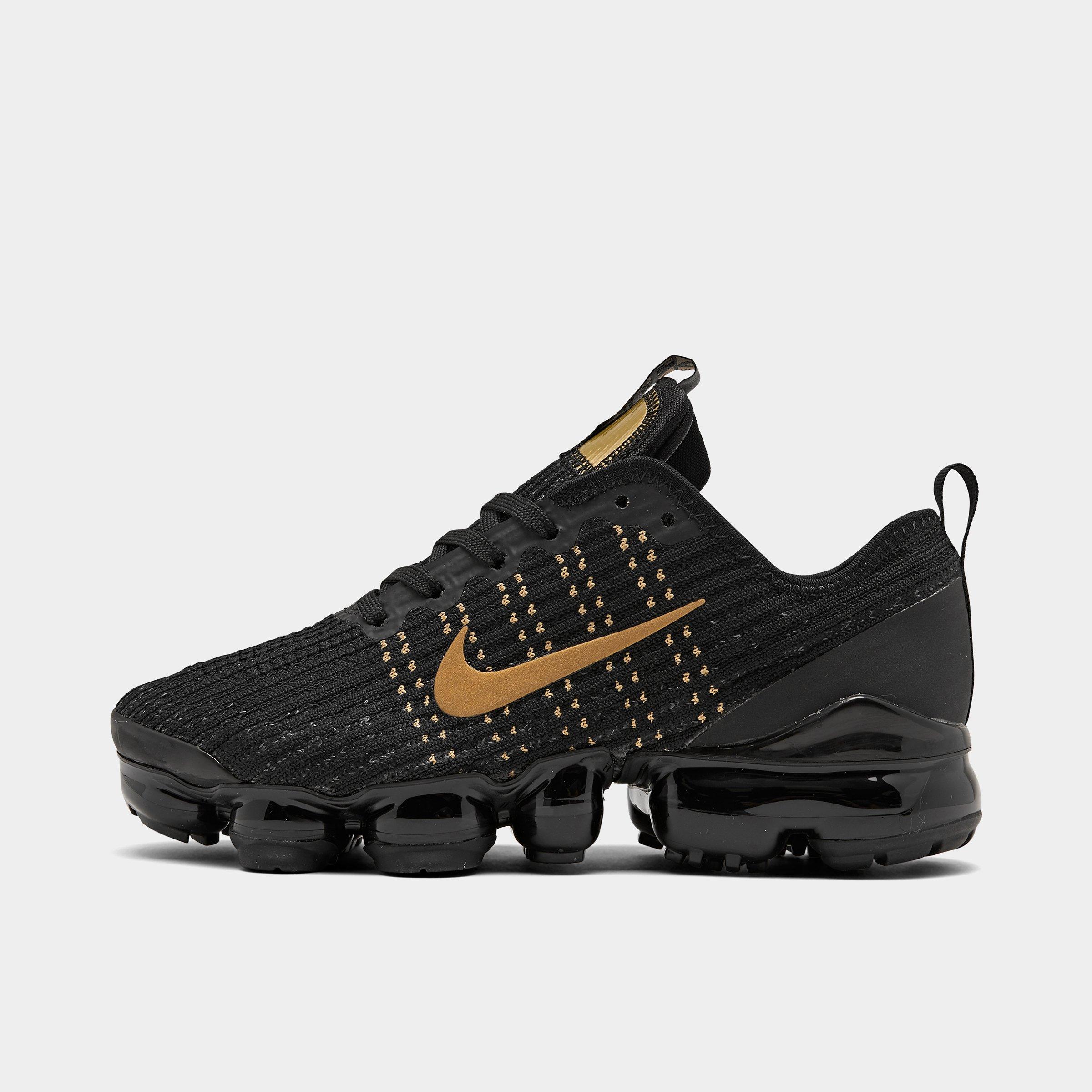 black and gold nikes kids