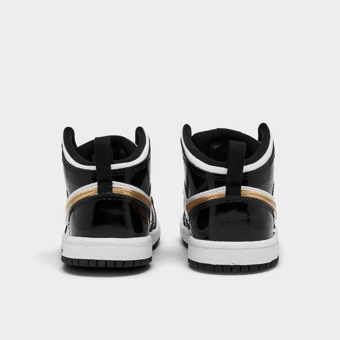 Toddler black 2024 and gold jordans