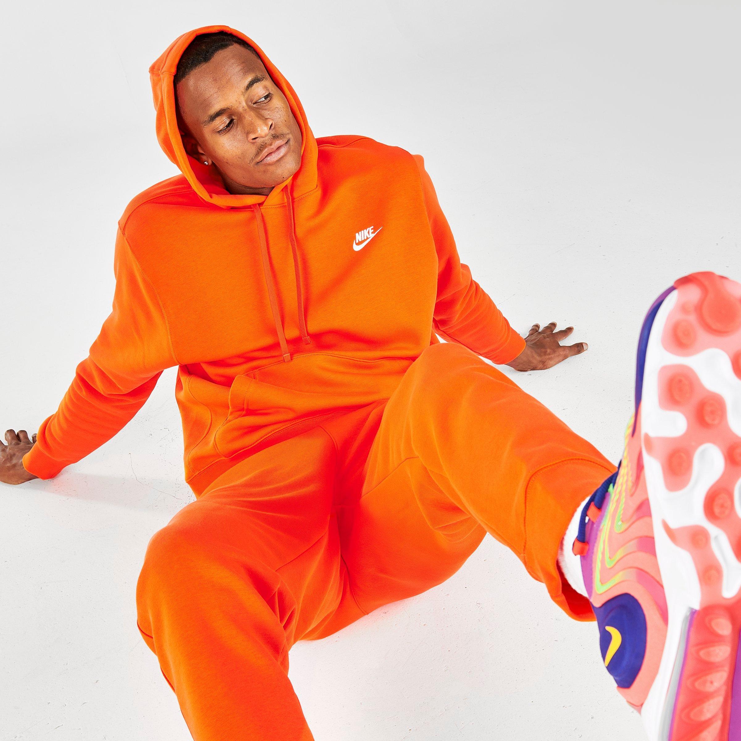 orange and white nike sweatsuit