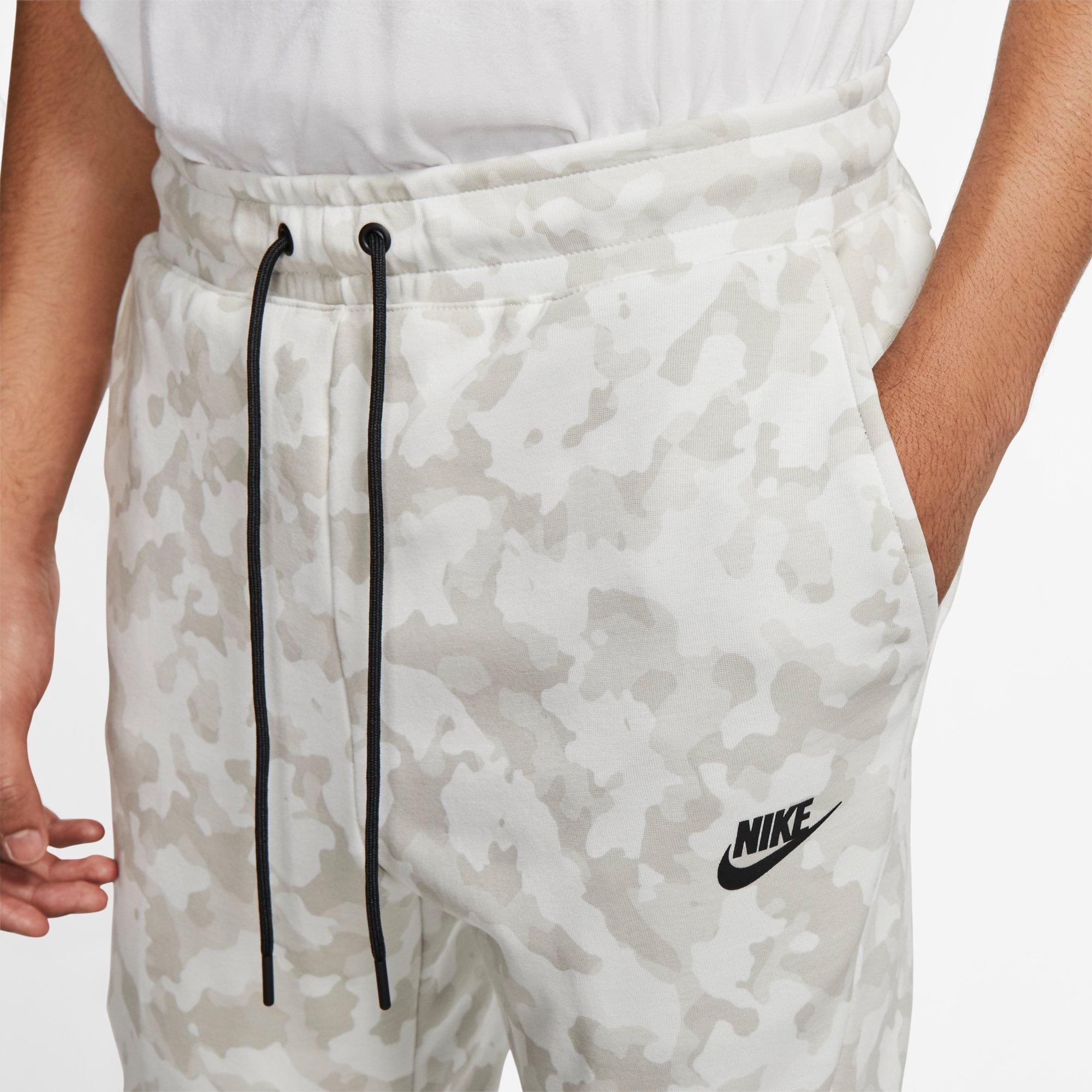 nike sportswear all over print track pants