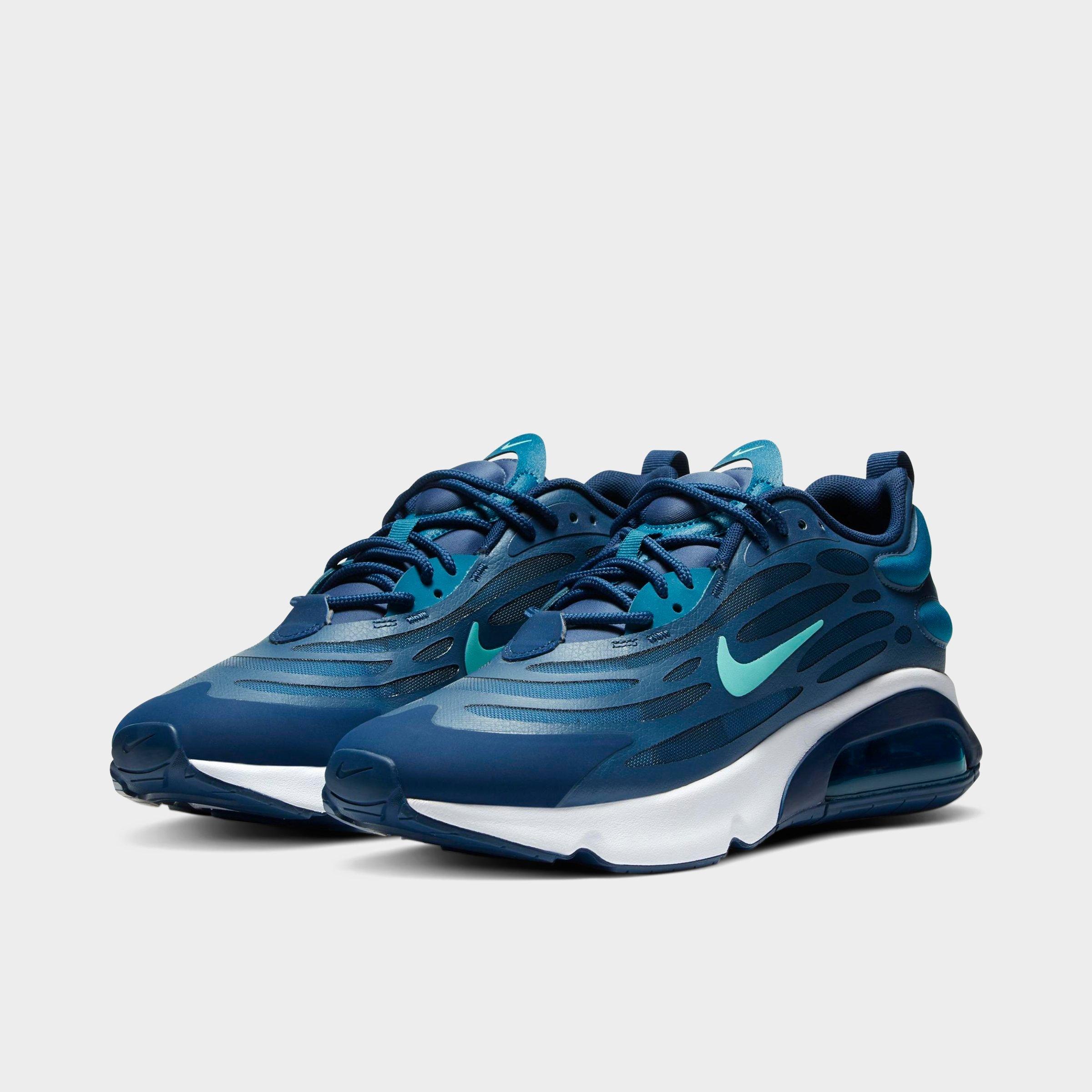 navy blue and green nike shoes