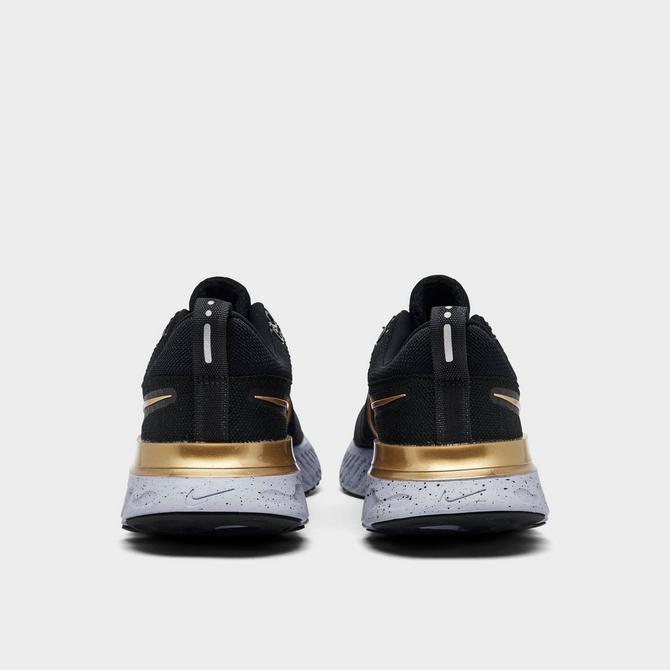 Black and outlet gold nike react