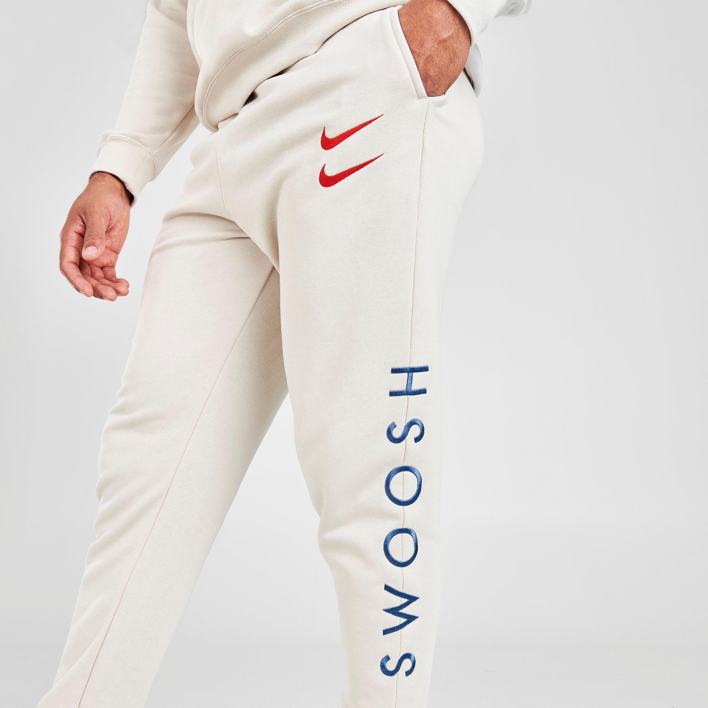 nike swoosh logo joggers