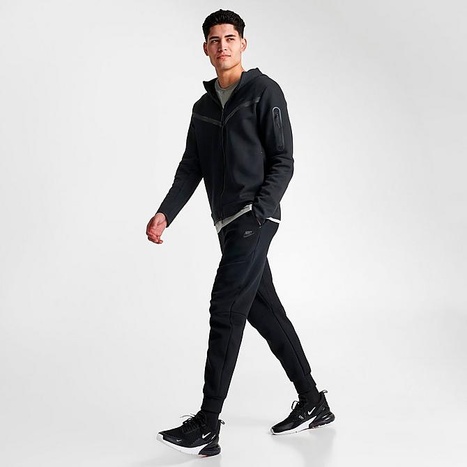 Front Three Quarter view of Nike Tech Fleece Taped Jogger Pants in Black Click to zoom