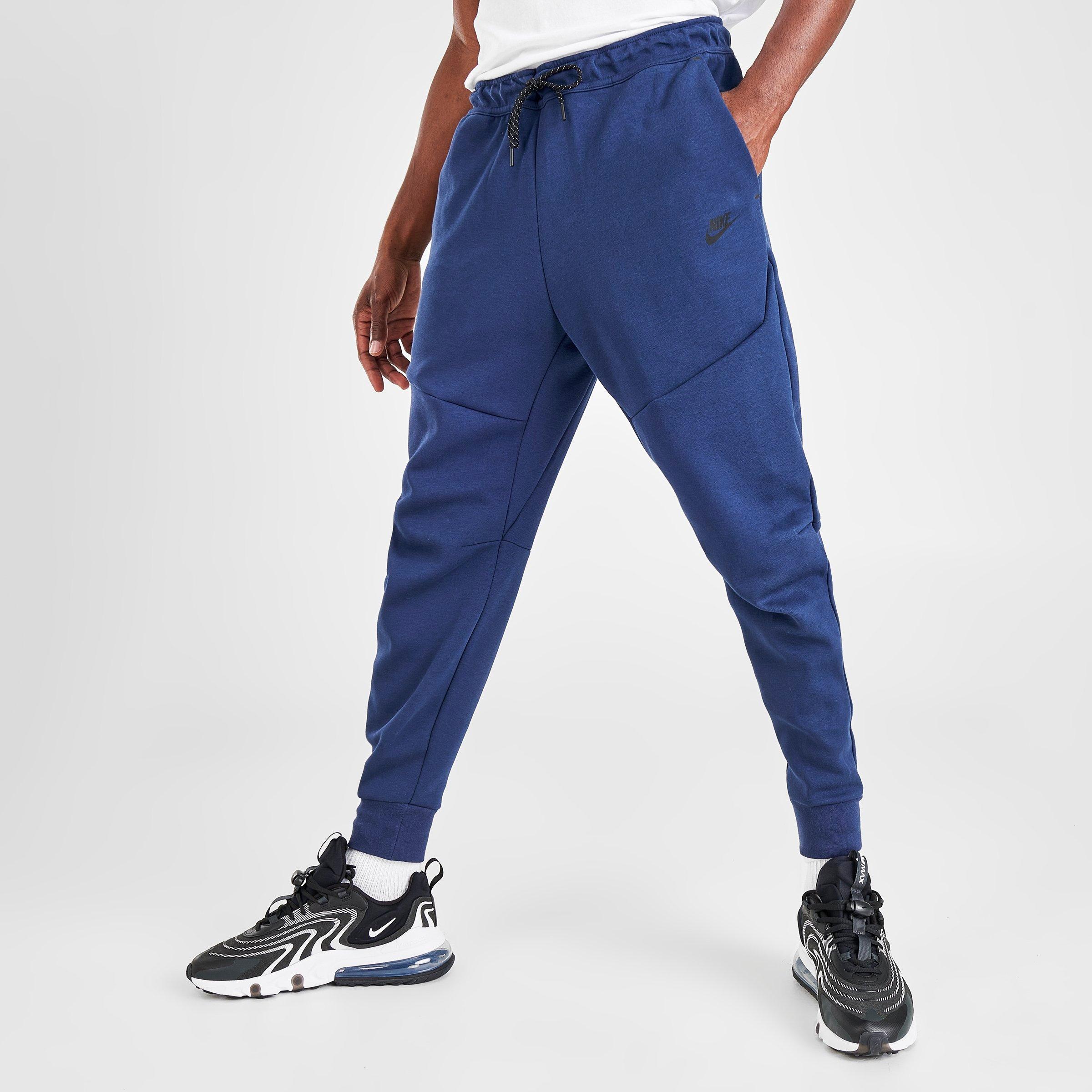 navy blue nike tech pants