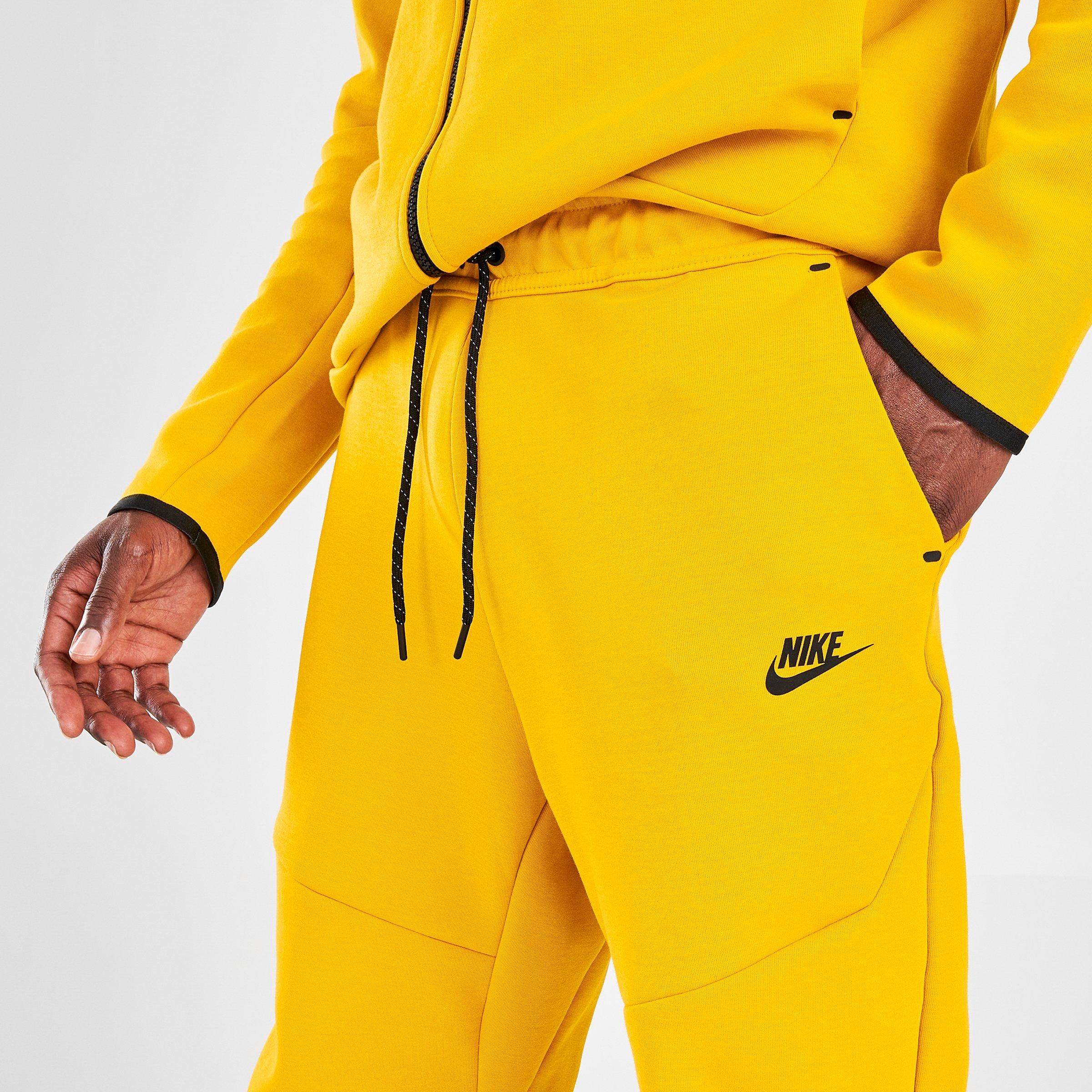 yellow nike tech suit