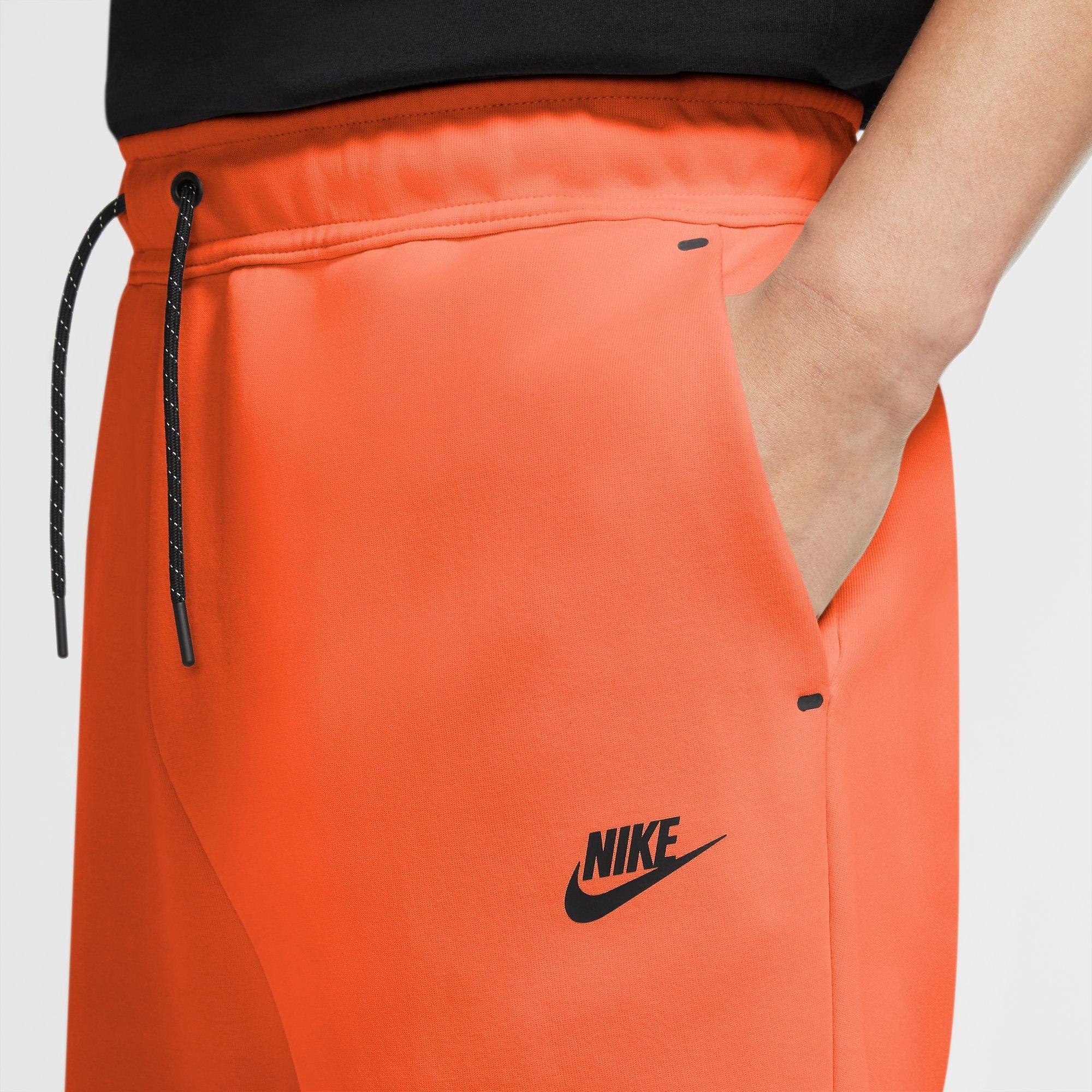 orange nike sweat shorts