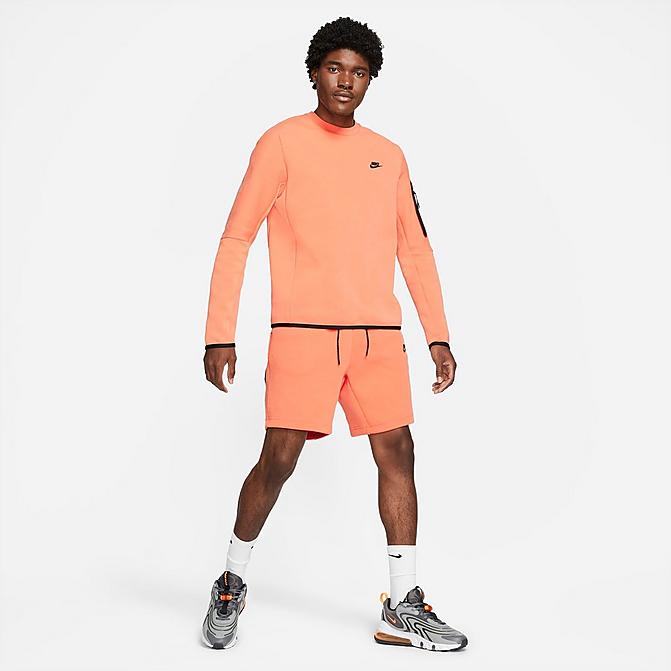 Front view of Men's Nike Sportswear Washed Tech Fleece Shorts in Orange Frost/Black Click to zoom