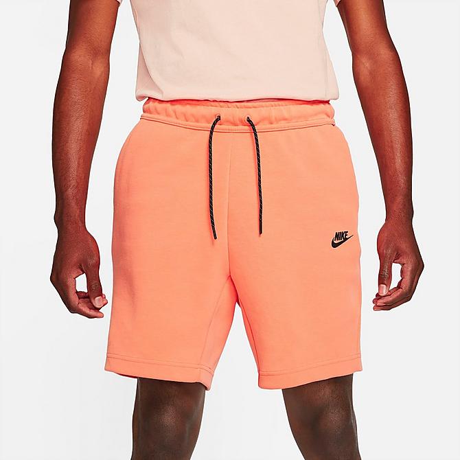 Back Left view of Men's Nike Sportswear Washed Tech Fleece Shorts in Orange Frost/Black Click to zoom