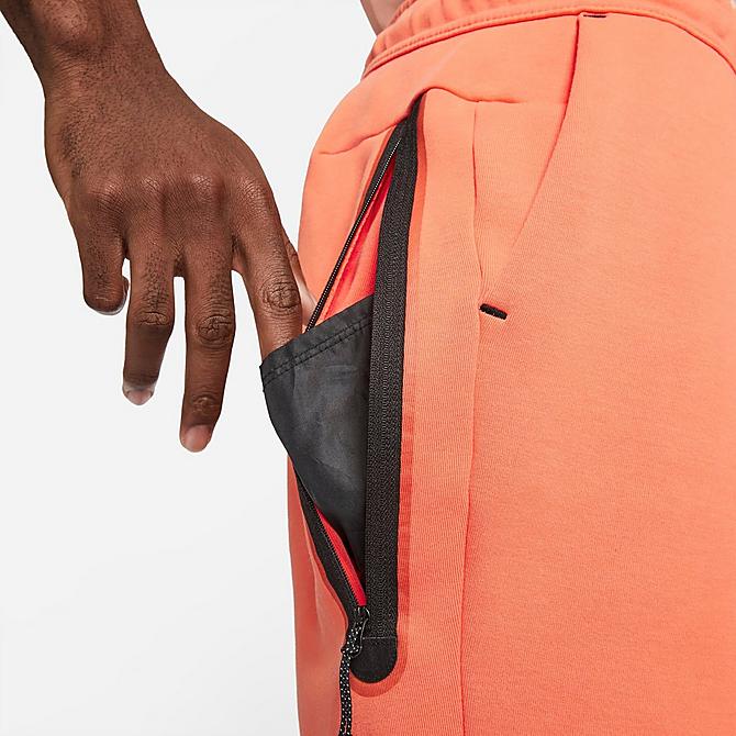 On Model 6 view of Men's Nike Sportswear Washed Tech Fleece Shorts in Orange Frost/Black Click to zoom