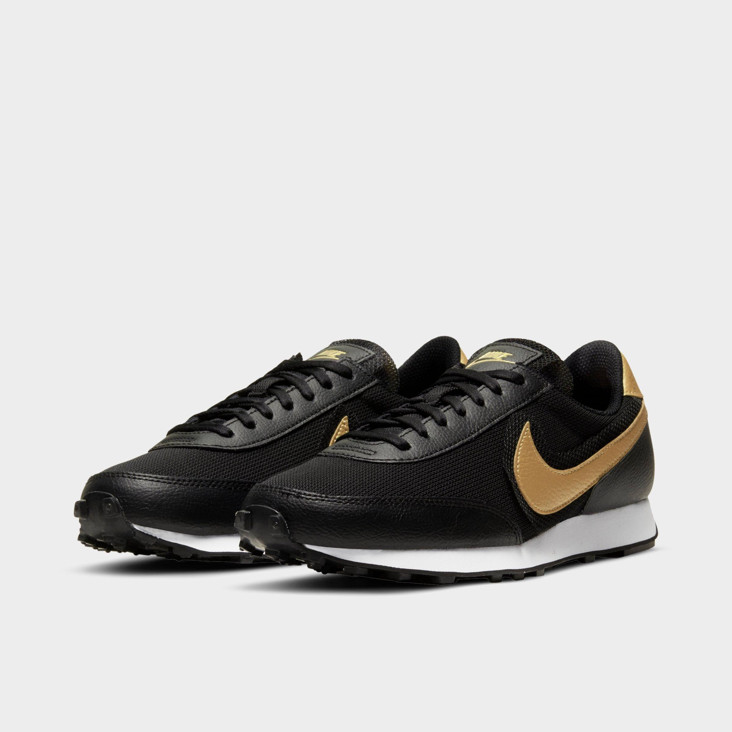 nike women's black and gold shoes