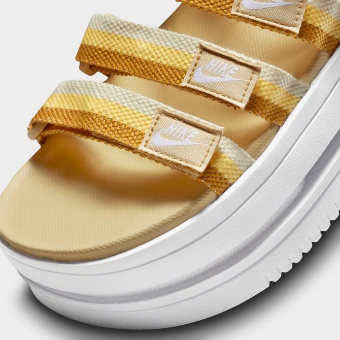 Nike sandals gold logo hotsell