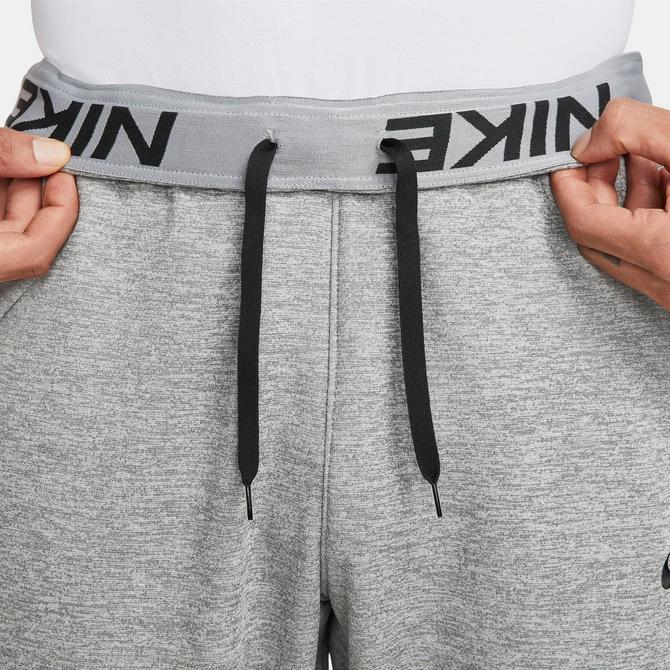 Nike mens dri-fit tapered logo sweatpants best sale