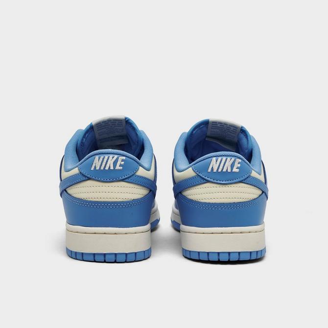 Left view of Nike Dunk Low Retro Casual Shoes in Coconut Milk/University Blue/Sail/White Click to zoom