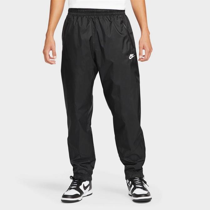 Nike Performance HERITAGE PANT - Tracksuit bottoms - black 