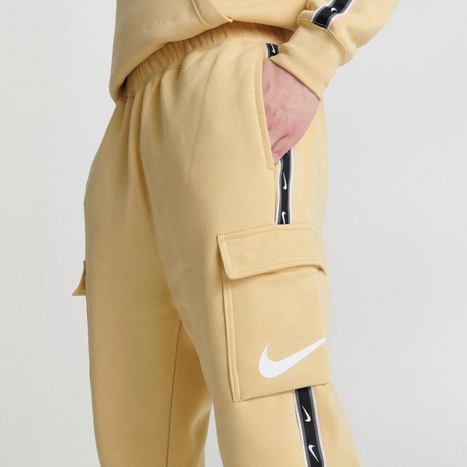 nike repeat logo taping cargo joggers in black