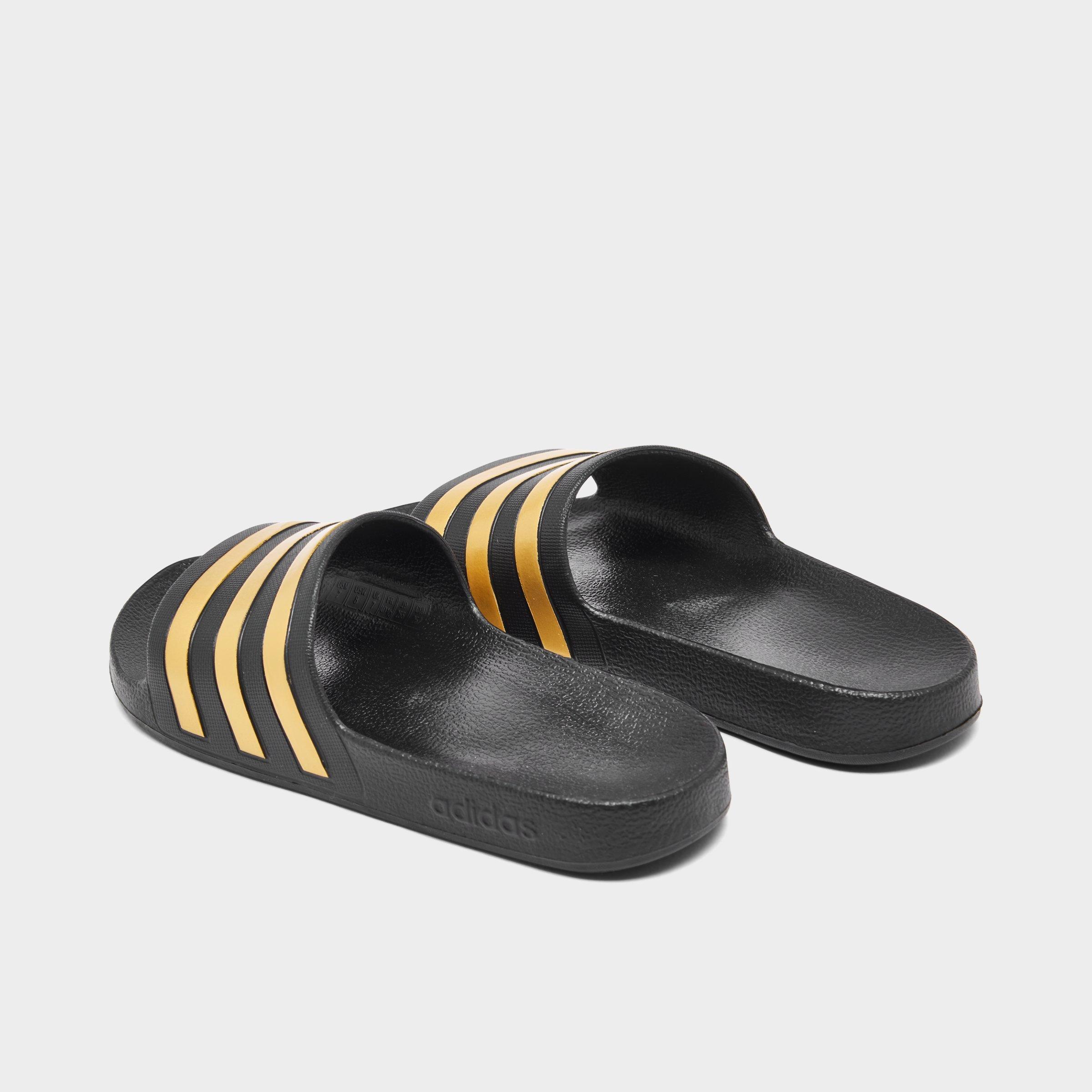 adidas flip flops black and gold