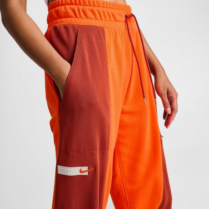 Nike track best sale pants orange