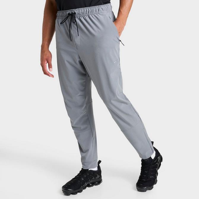 Nike Men Dri-Fit Challenger Woven Pants in Smoke Grey,Different