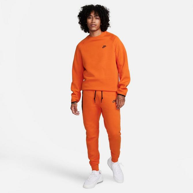 Orange nike hot sale tech pants