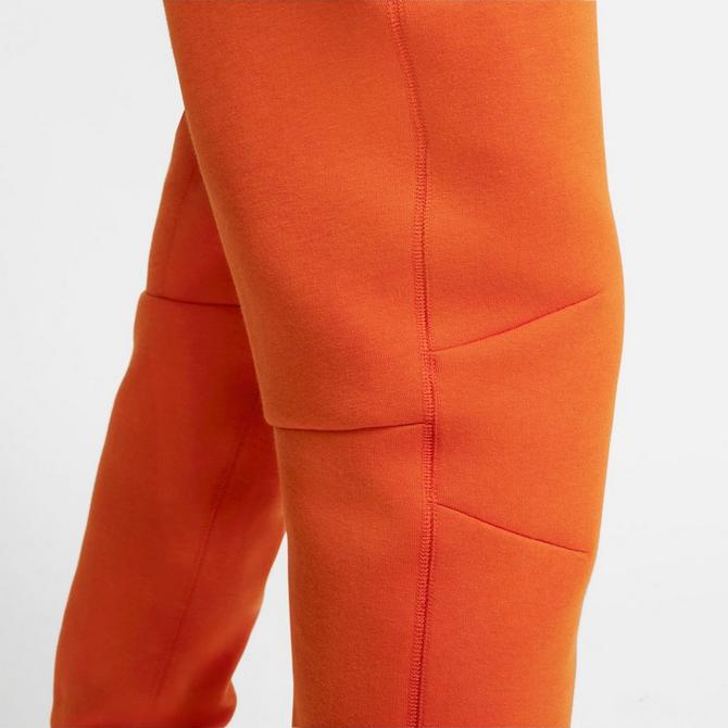 Nike tech cheap fleece pants orange