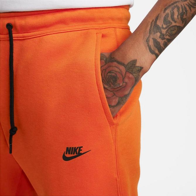 Black and orange nike joggers sale