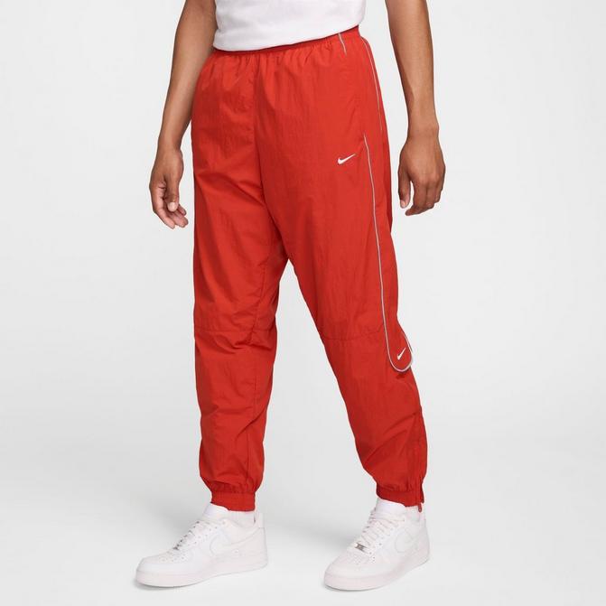 Nike swoosh cuff retailer track pants