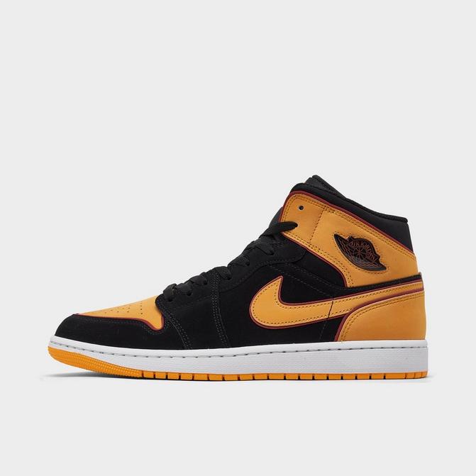 Black and yellow hotsell jordan aj 1 mid