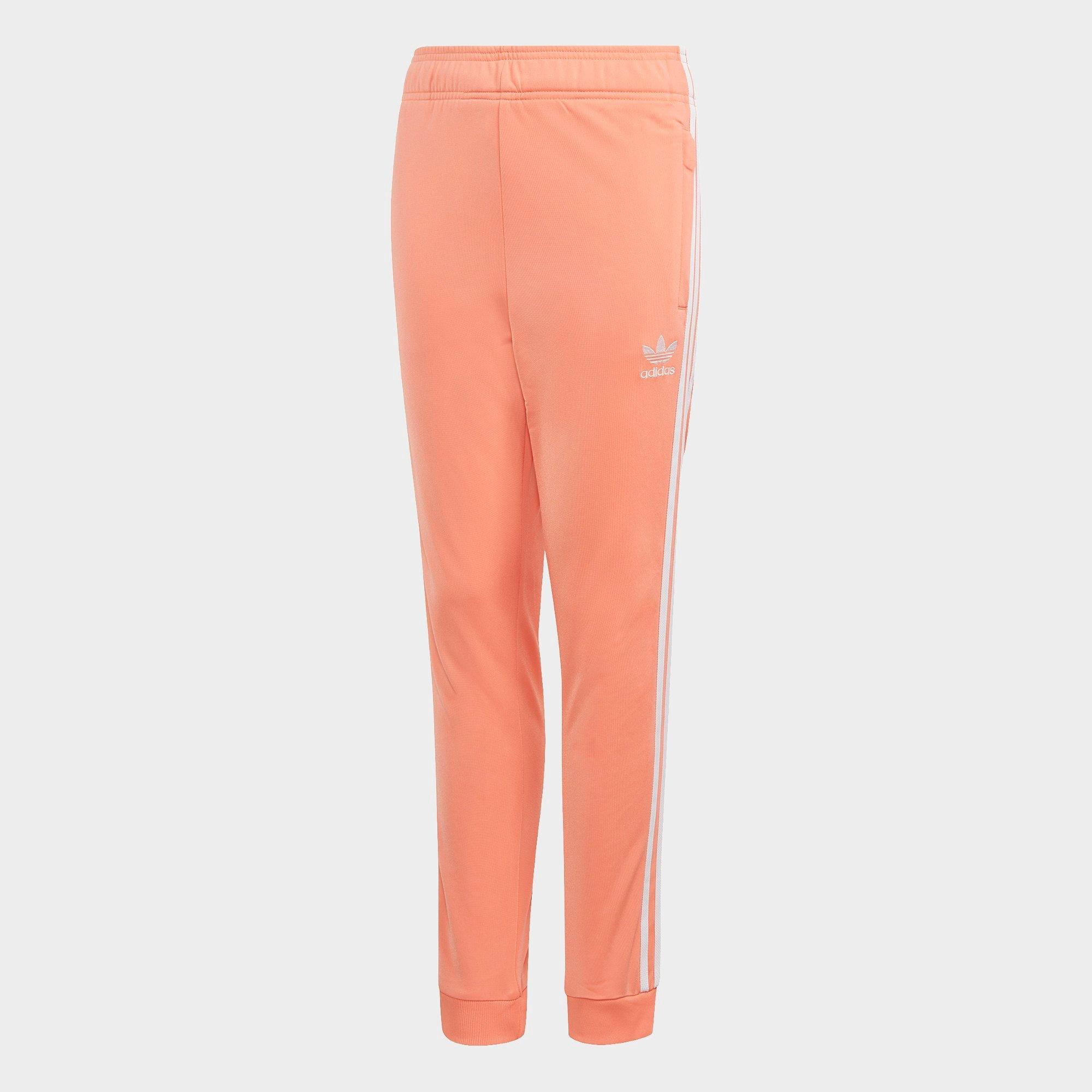 adidas sst track pants orange