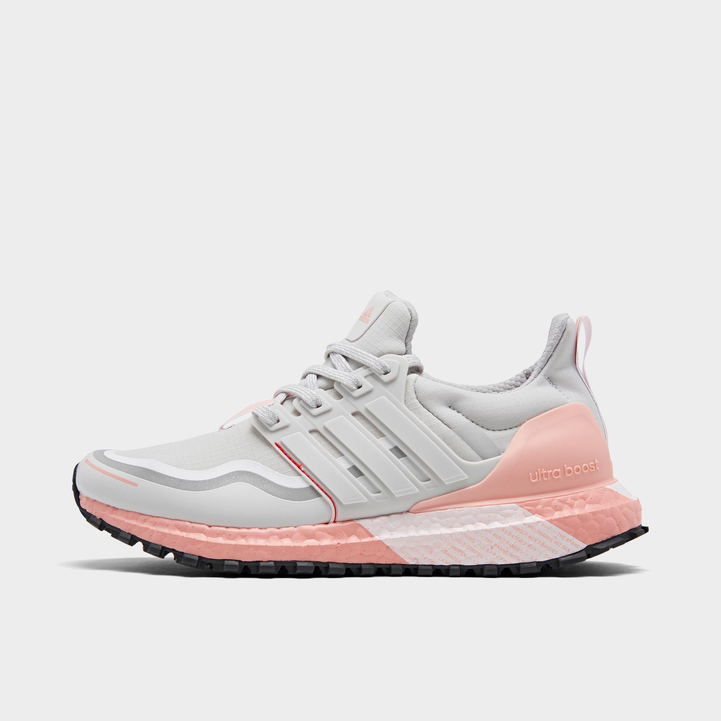 white and pink running shoes