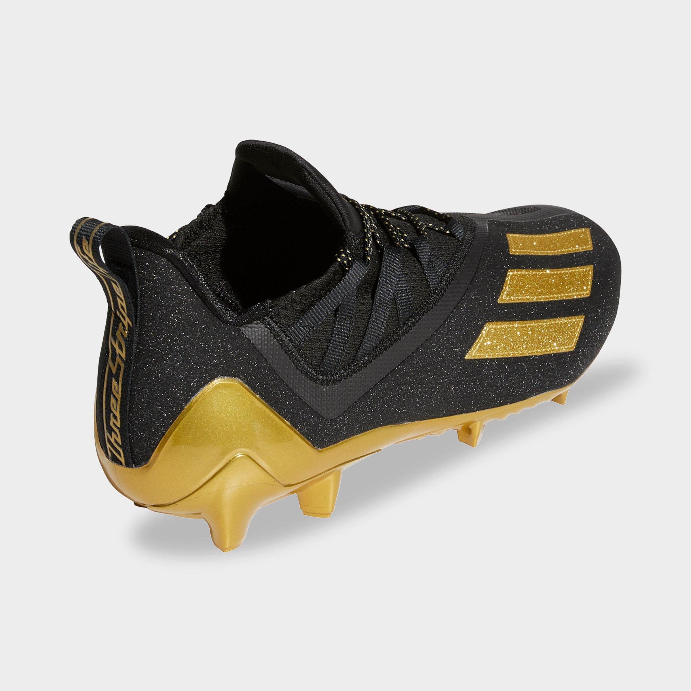 football cleats gold black
