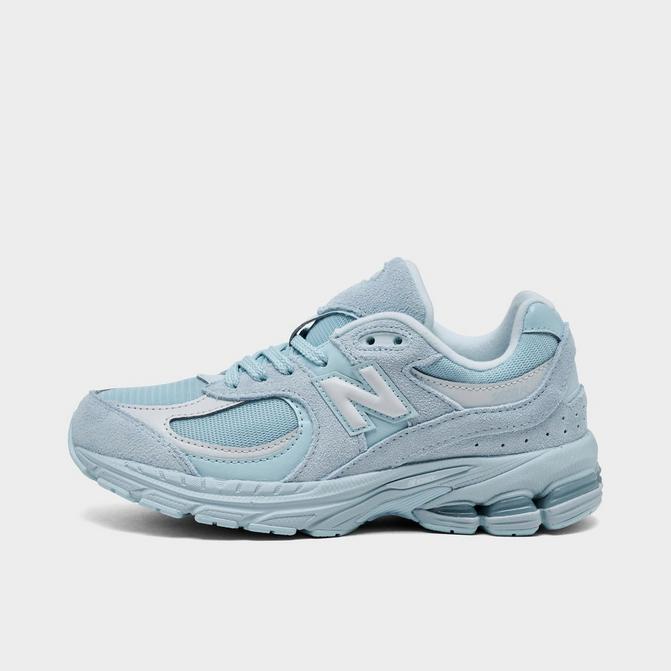 Right view of Big Kids' New Balance 2002R Casual Shoes in Light Blue Click to zoom