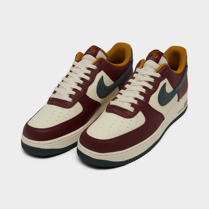 Three Quarter view of Men's Nike Air Force 1 '07 LV8 Casual Shoes in Coconut Milk/Dark Team Red/Bronzine/Vintage Green Click to zoom