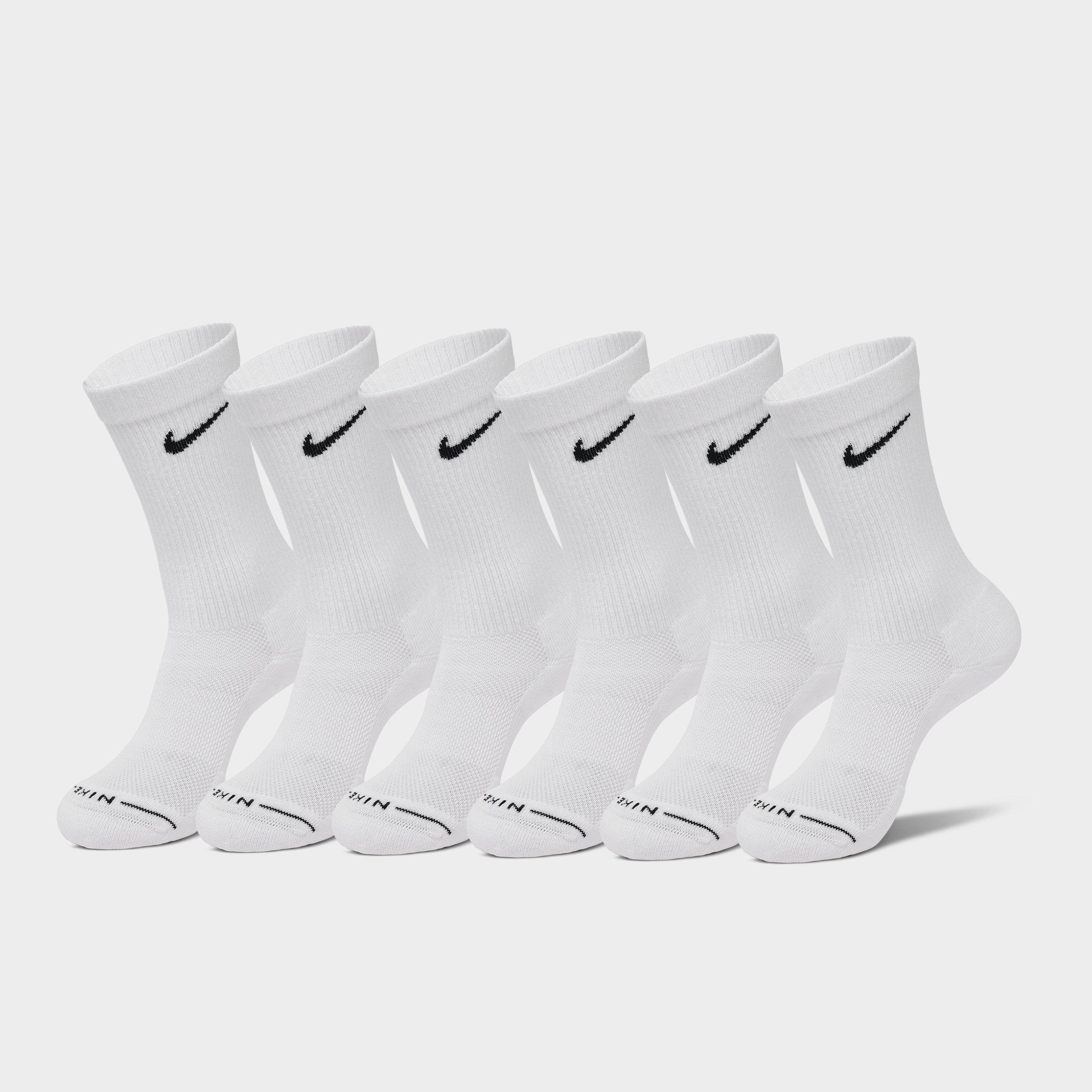 Men's Nike Everyday Plus Cushioned Crew Training Socks in white. Pack of ribbed athletic socks featuring the iconic Nike black swoosh.