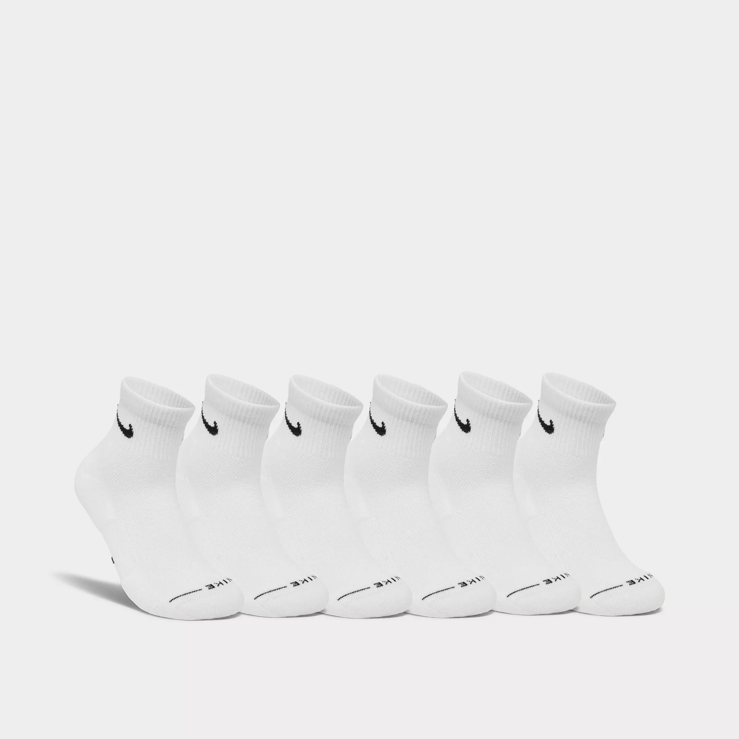 Men's Nike Everyday Plus Cushioned Crew Training Socks in white. Pack of ribbed athletic socks featuring the iconic Nike black swoosh.