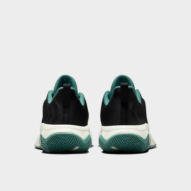 Left view of Big Kids’ Nike Giannis Immortality 4 Basketball Shoes in Black/Metallic Gold/Bicoastal/Pale Ivory Click to zoom