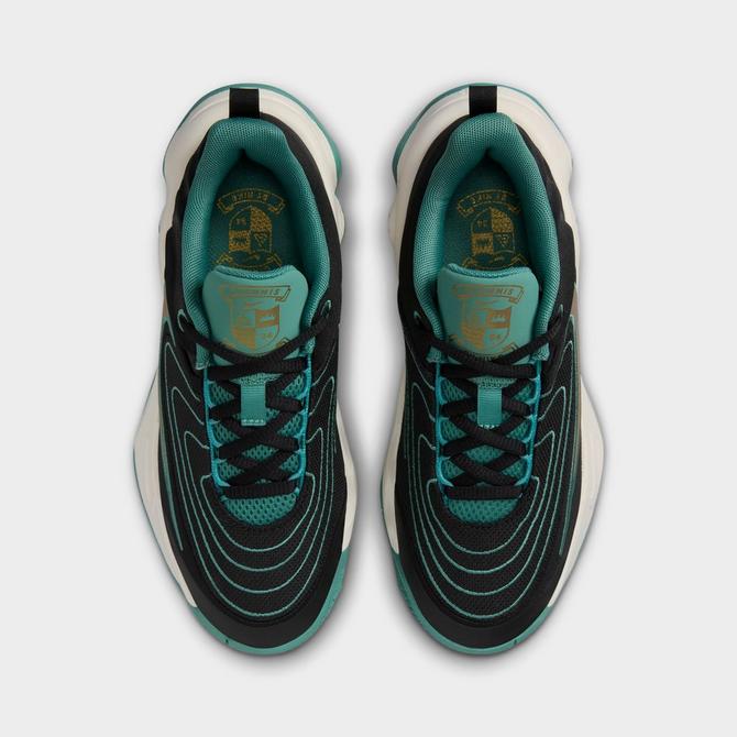 Back view of Big Kids’ Nike Giannis Immortality 4 Basketball Shoes in Black/Metallic Gold/Bicoastal/Pale Ivory Click to zoom