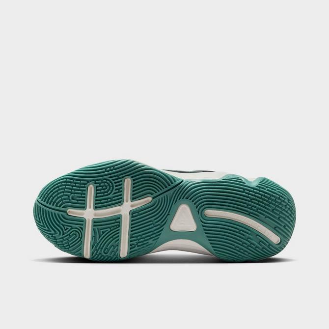 Bottom view of Big Kids’ Nike Giannis Immortality 4 Basketball Shoes in Black/Metallic Gold/Bicoastal/Pale Ivory Click to zoom