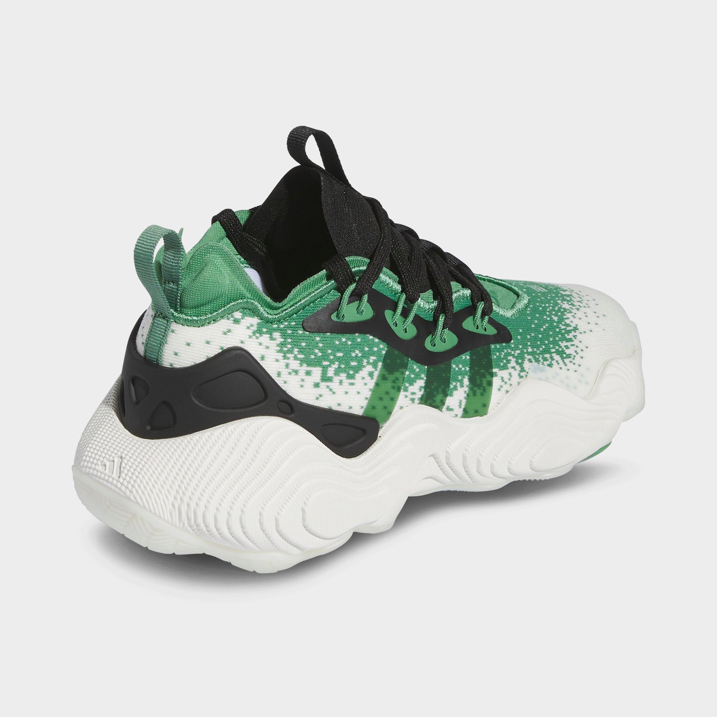 Black and green adidas basketball shoes